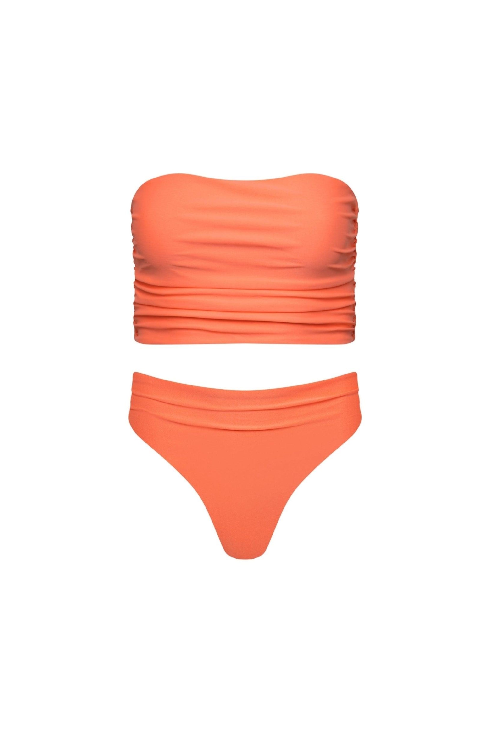A strapless, longline peach tankini set with ruching and a high-waisted thong bikini bottom.