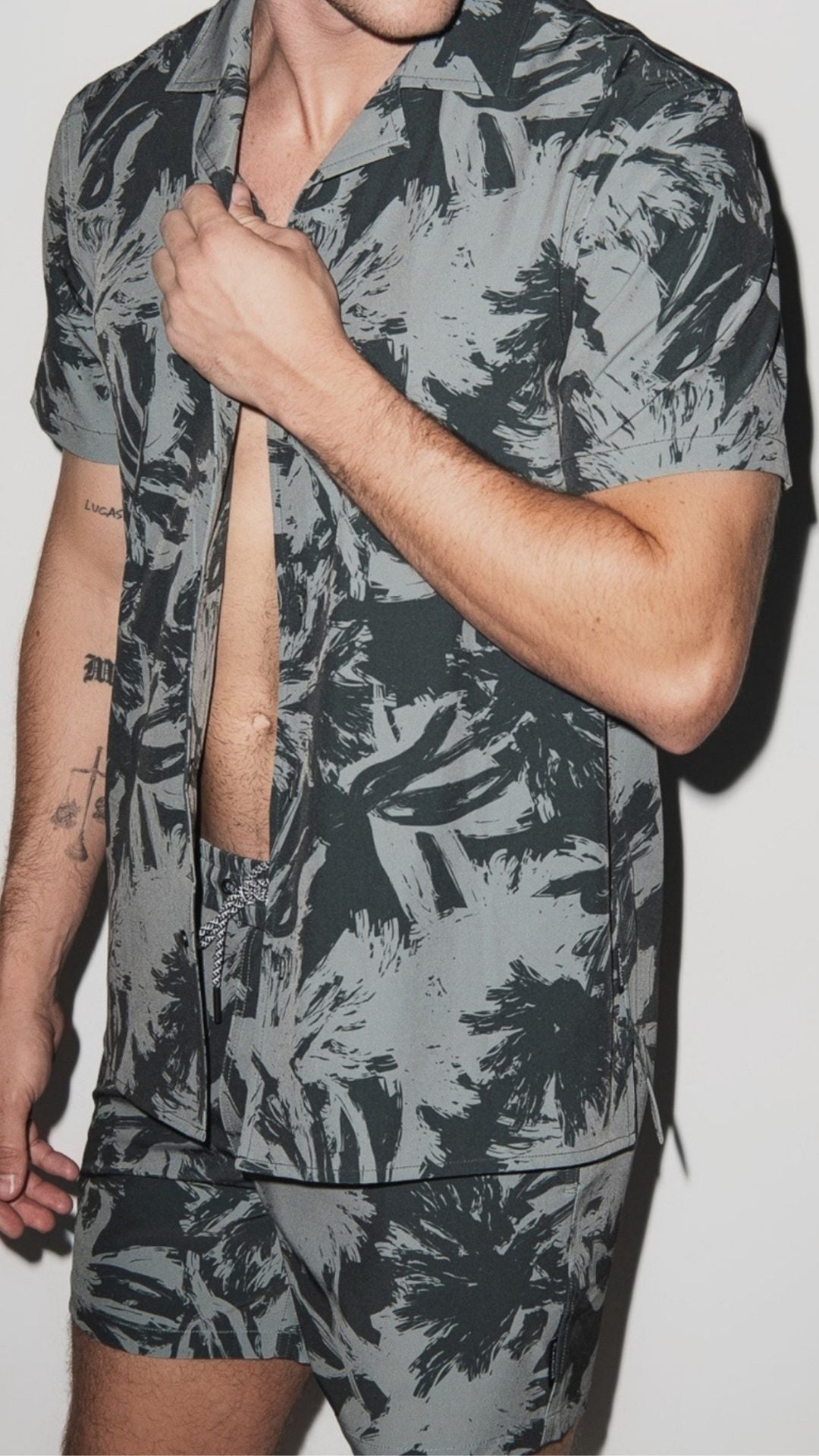 Man wearing a green PLAYALUXE cabana set